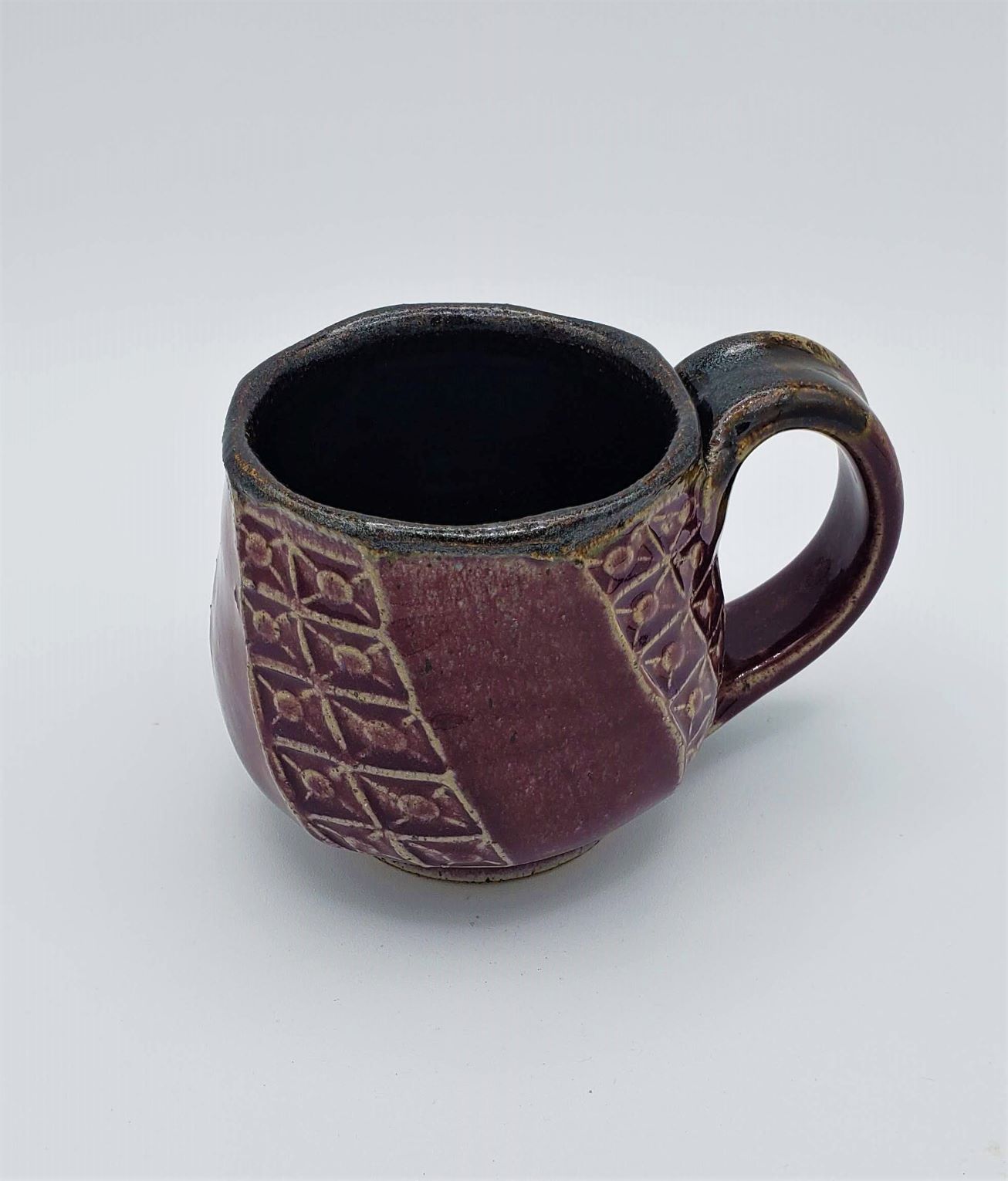 https://twist-of-fate-pottery.com/wp-content/uploads/2021/10/purplefactedmug2.jpg